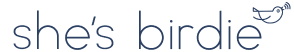 Logo with the text 'she's birdie' and a small bird illustration.