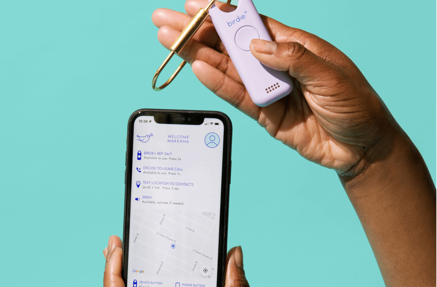 Hand holding a smartphone displaying a safety app and a personal safety device against a teal background.